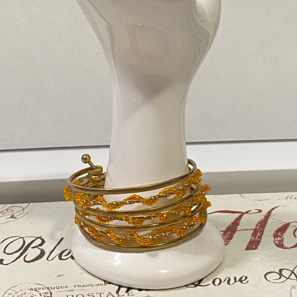 Gold Tone Women metal and orange seed beads wire wrapped  cuff bracelet. Used.